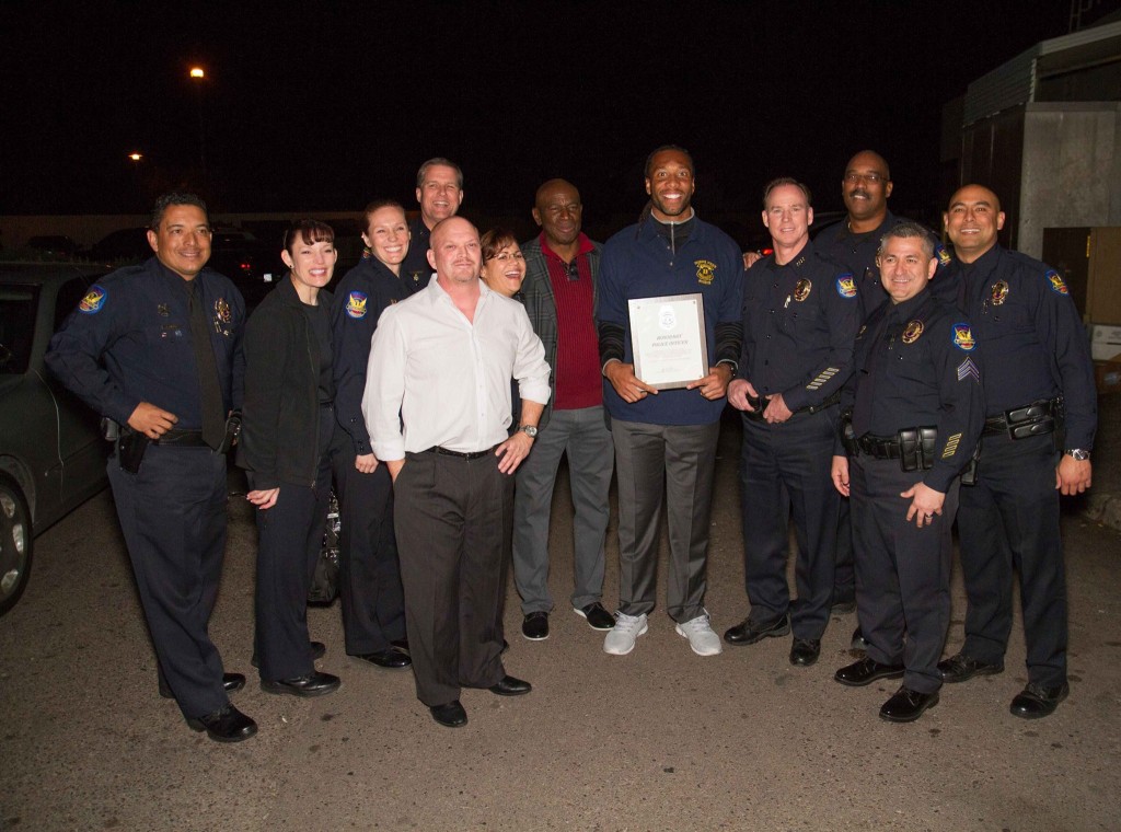 Phoenix Police Chief awards Roy Green and Larry Fitzgerald police chief for life while David Gergen looks on